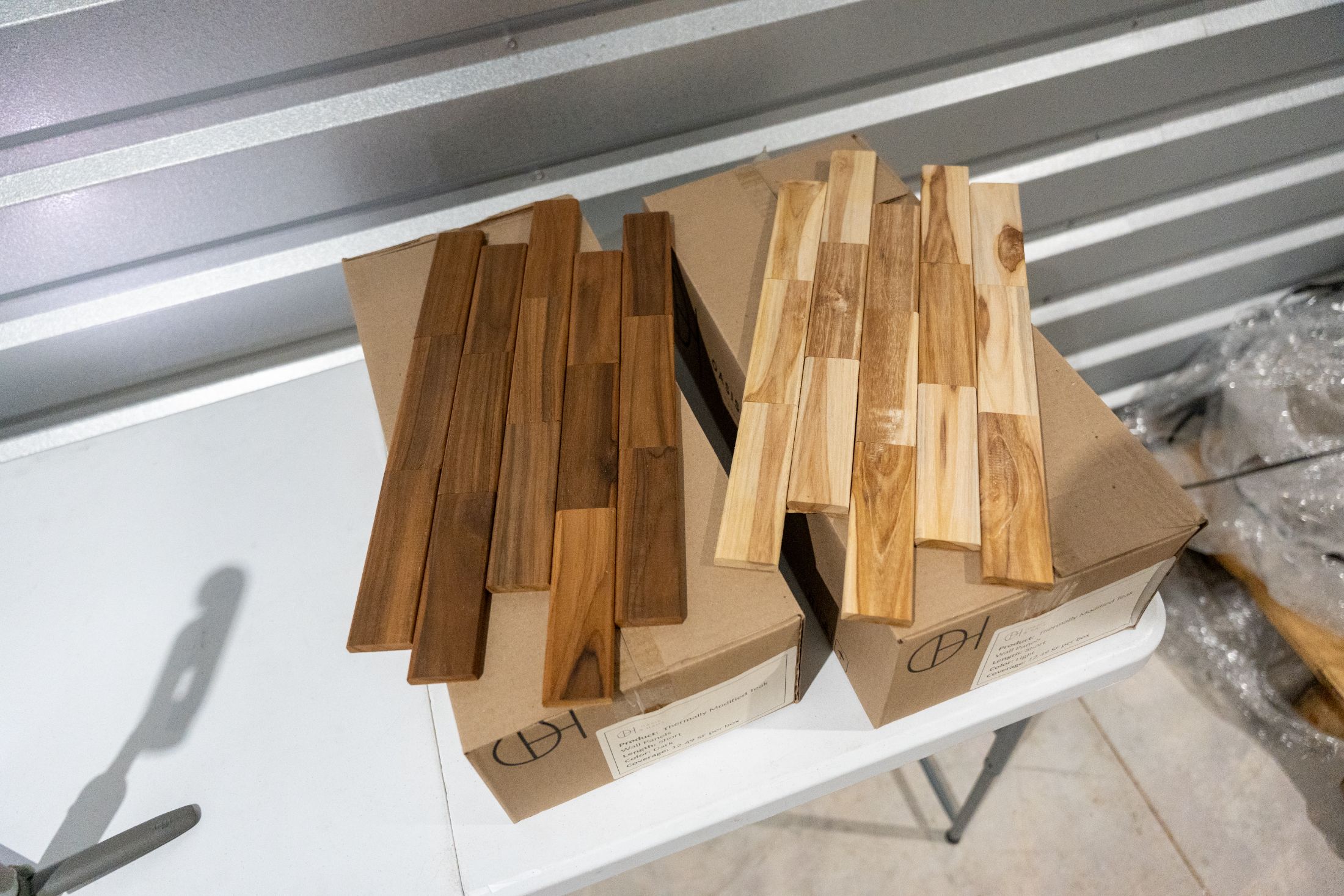 Light and Dark teak panels showing the interlocking puzzle pattern