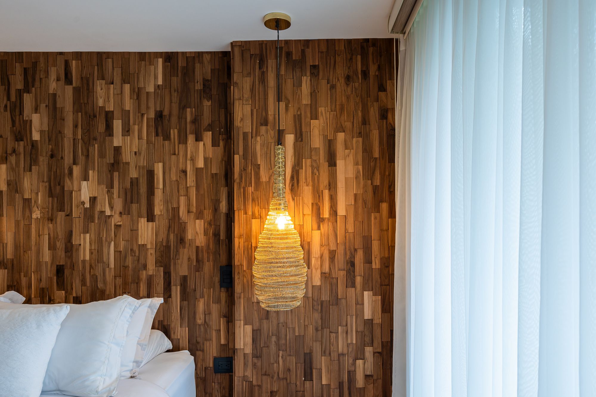 Natural wood variation under warm pendant light