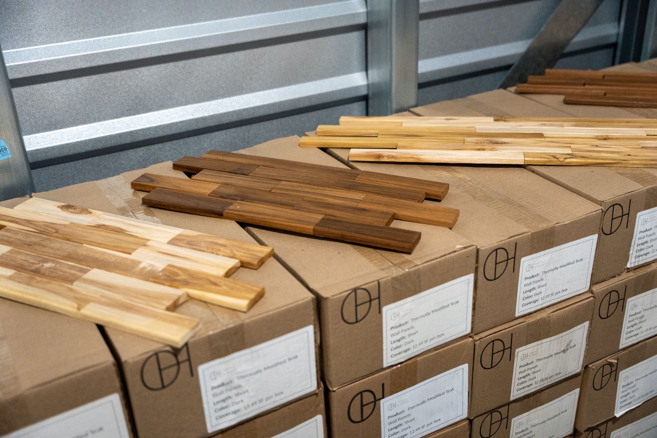 Boxed Oasis & Haus teak panels ready for the jobsite